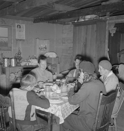 The Wardlow family in their dugout basement home. Dead Ox Flat, Malheur County, Oregon.