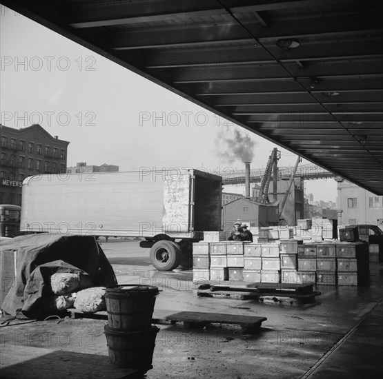 New York, New York. Crates of seafood waiting for delivery at the Fulton fish market.