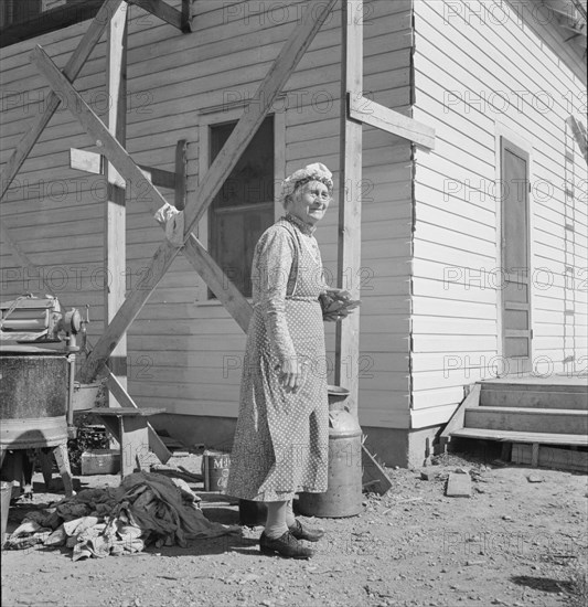 Soper grandmother helps the large family. Willow Creek area, Malheur County, Oregon.