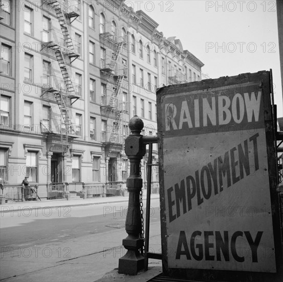 New York, New York. One of the numerous employment agency signs in the Harlem area.
