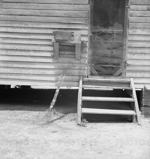 Kitchen door of Zollie Lyon's house. Note brushbroom. Wake County, North Carolina.