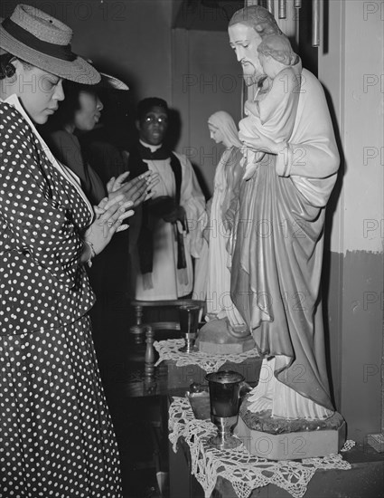 Washington, D.C. Worshipper before the altar of the St. Martin's Spiritual Church.