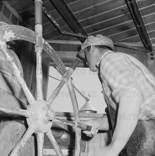 Scene in a pilot house during a mackeral school chase. Gloucester, Massachusetts.