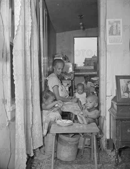 Washington, D.C. Mrs. Ella Watson, a government charwoman and her grandchildren.