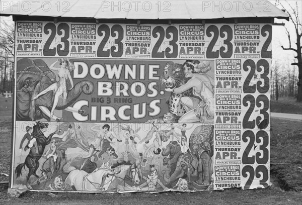 Posters covering a building near Lynchburg to advertise a Downie Bros. circus.