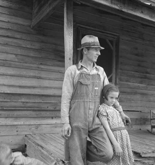 Tobacco sharecropper with his oldest daughter. Person County, North Carolina.