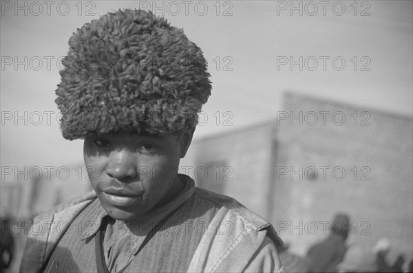 Negro with a fur cap, a flood refugee in the camp at Forrest City, Arkansas.