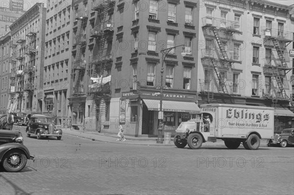 New York, New York. 61st Street between 1st and 3rd Avenues. A street scene.