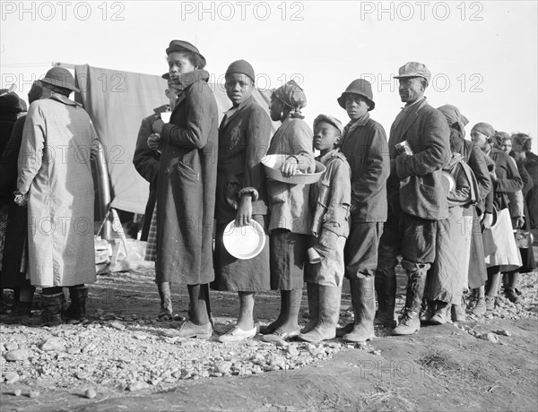 Negroes waiting for food in the Forrest City, Arkansas, concentration camp.