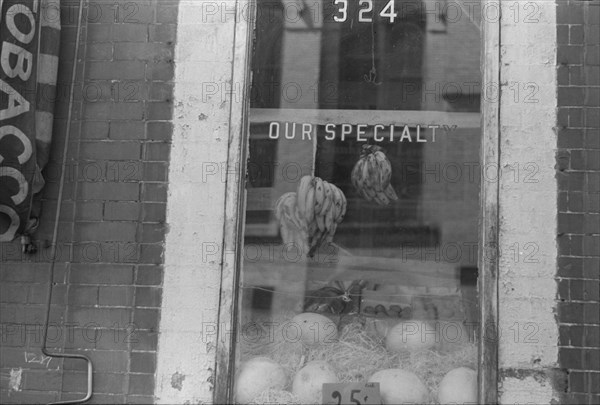 New York, New York. 61st Street between 1st and 3rd Avenues. A shop window.