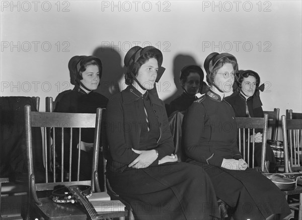 Visiting lassies sit on rostrom. Salvation Army, San Francisco, California.