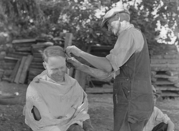 Bean pickers barbering each other. Near West Staten, Marion County, Oregon.