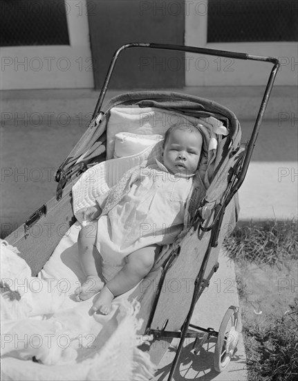 Anacostia, D.C. Frederick Douglass housing project. Baby taking a sun bath.