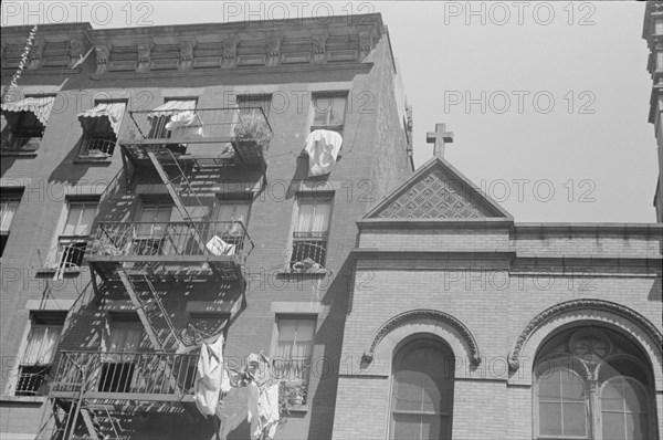 New York, New York. 61st Street between 1st and 3rd Avenues. House fronts.