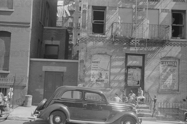 New York, New York. 61st Street between 1st and 3rd Avenues. House fronts.