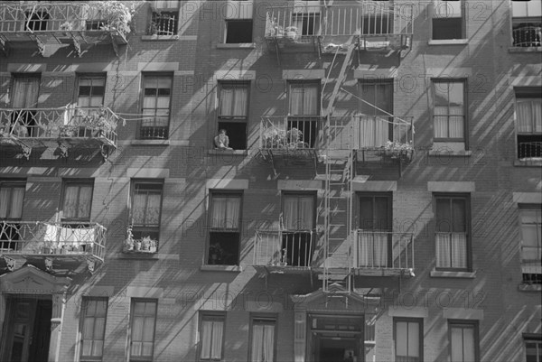 New York, New York. 61st Street between 1st and 3rd Avenues. House fronts.