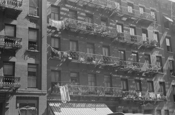 New York, New York. 61st Street between 1st and 3rd Avenues. House fronts.