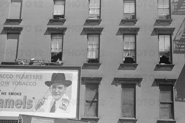 New York, New York. 61st Street between 1st and 3rd Avenues. House fronts.