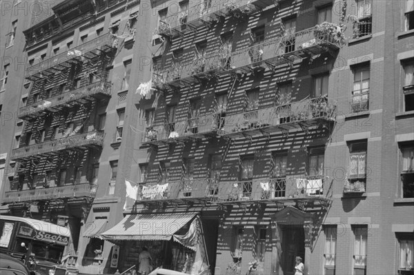 New York, New York. 61st Street between 1st and 3rd Avenues. House fronts.