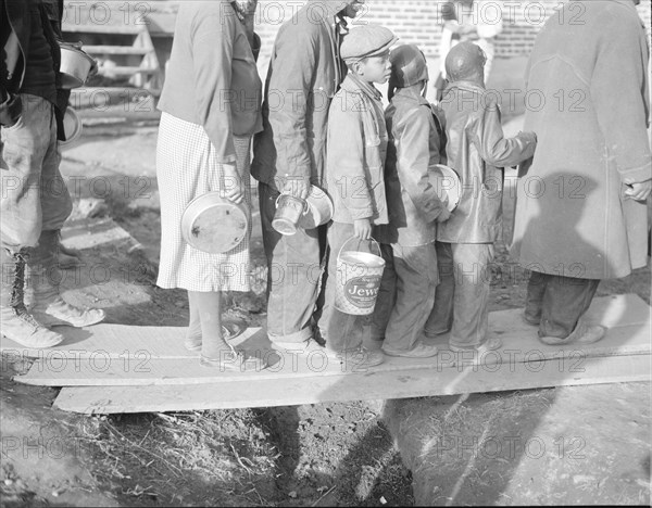 Negroes waiting for food in the Forrest City, Arkansas, refugee camp.