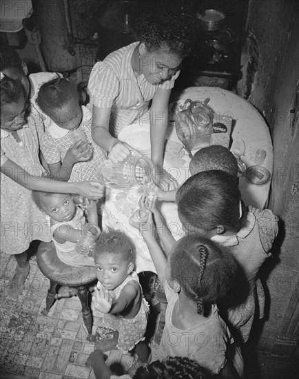 Washington, D.C. Pouring lemonade at a birthday party on Seaton Road.