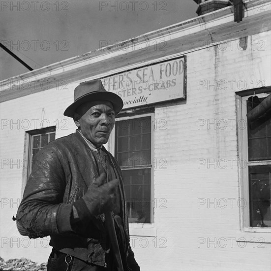 [Untitled photo, possibly related to: Washington, D.C. Dock worker].