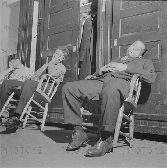 Washington, D.C. Firemen taking a nap in engine house number four.