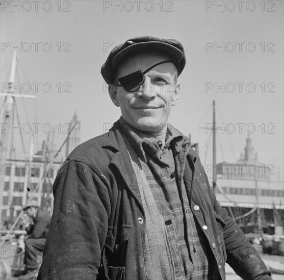 New York, New York. Dock stevedore at the Fulton fish market.