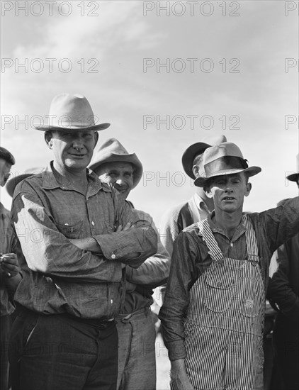 Watching ball game. Shafter camp for migrants. California.