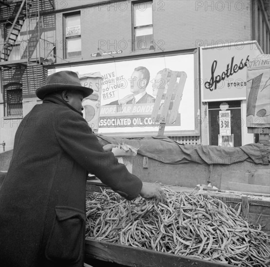 New York, New York. Street peddler in the Harlem section.