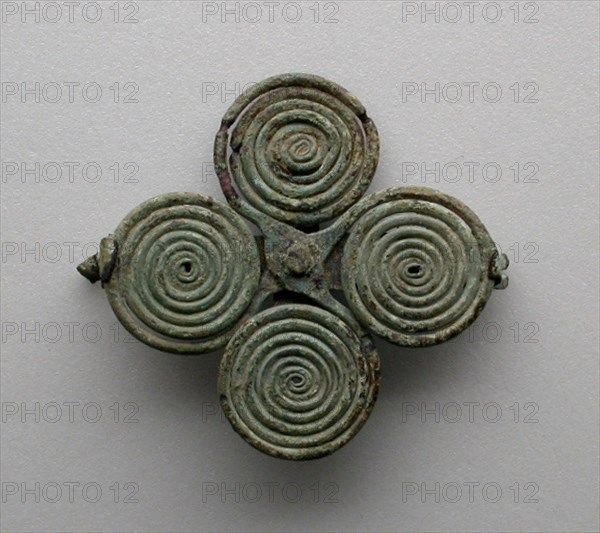 Quatrefoil spiral fibula (garment pin), 7th century BCE.