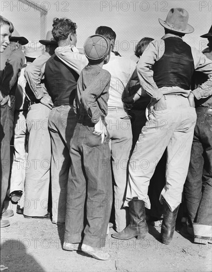 Watching ball game. Shafter migrant camp. California.