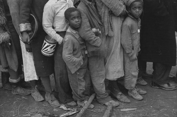 Flood refugees at mealtime, Forrest City, Arkansas.