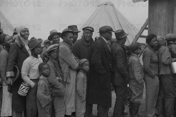 Flood refugees at mealtime, Forrest City, Arkansas.