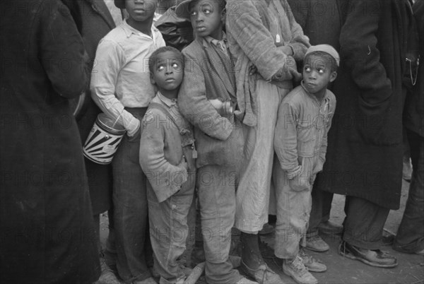 Flood refugees at mealtime, Forrest City, Arkansas.