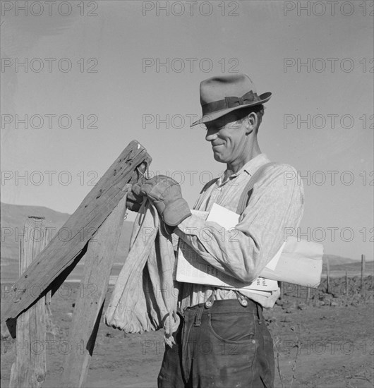 Farmer getting the morning mail. Gem County, Idaho.