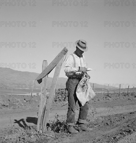 Farmer getting the morning mail. Gem County, Idaho.