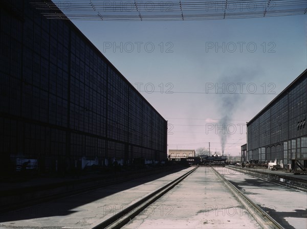 A completely overhauled engine on the transfer table at the Atchison, Topeka..., New Mexico., 1943. Creator: Jack Delano.