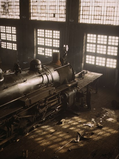 C & NW RR working on a locomotive at the 40th Street railroad shops, Chicago, Ill., 1942. Creator: Jack Delano.