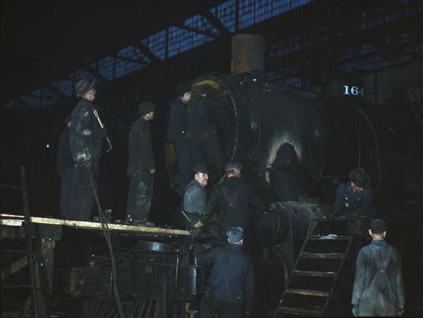 Working on a locomotive at the 40th Street shop of the C & NW RR, Chicago, Ill., 1942. Creator: Jack Delano.