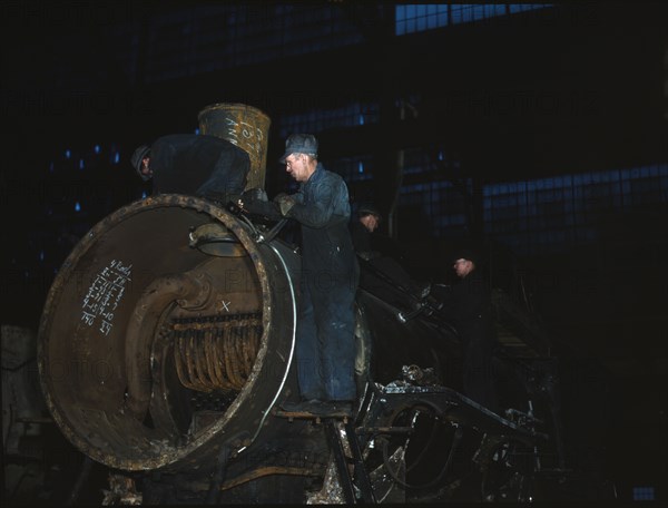 Working on the boiler of a locomotive at the 40th Street shops of the C & NW RR, Chicago, Ill., 1942 Creator: Jack Delano.