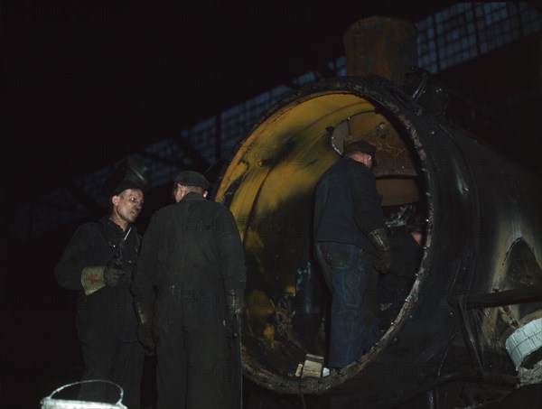 Working on the boiler of a locomotive at the 40th Street shops of the C & NW RR, Chicago, Ill., 1942 Creator: Jack Delano.