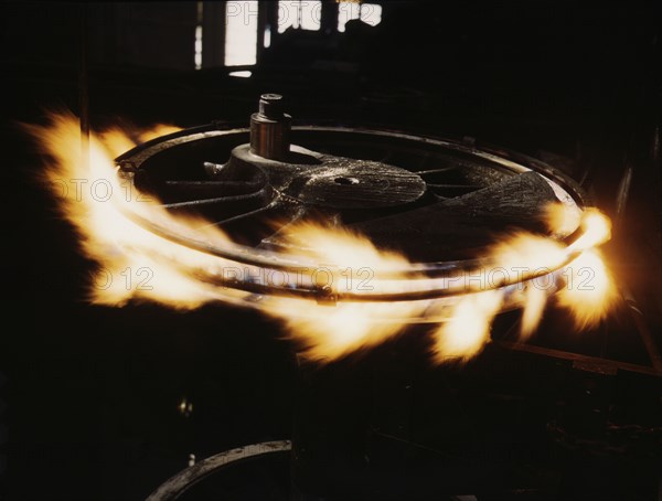 Retiring a locomotive driver wheel, Shopton, Iowa, 1943. Creator: Jack Delano.