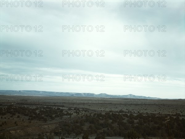 Santa Fe R.R. freight train rounding a curve between Ash Fork and Gleed, Arizona, 1943. Creator: Jack Delano.