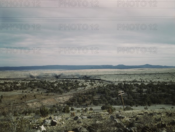 West-bound passenger train going around a curve on the Atchison..., near Gleed, Arizona, 1943. Creator: Jack Delano.