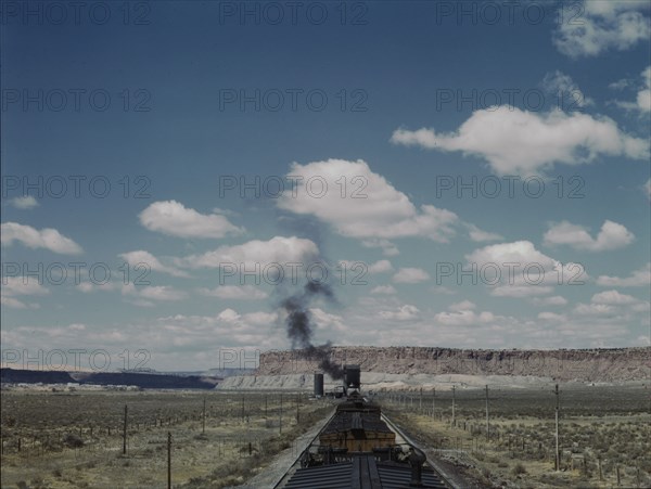 Santa Fe R.R. train stopping for coal and water, Laguna, New Mexico, 1943. Creator: Jack Delano.