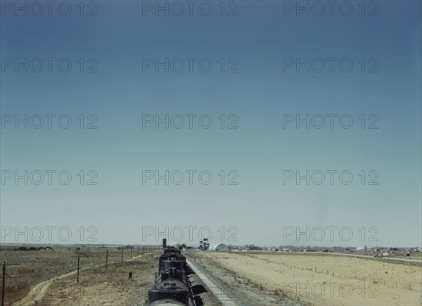 Westbound freight train stopping for water, Melrose, New Mexico, 1943. Creator: Jack Delano.