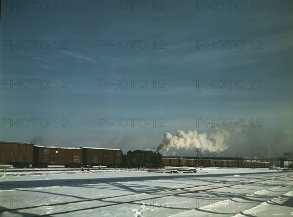 A train pulling out of the freight house at C & NW RR's Proviso(?) yard, Chicago, Ill., 1942. Creator: Jack Delano.