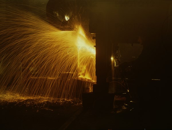 A welder who works in the round-house at the Chicago and Northwestern Railroad's Proviso yard, 1942. Creator: Jack Delano.