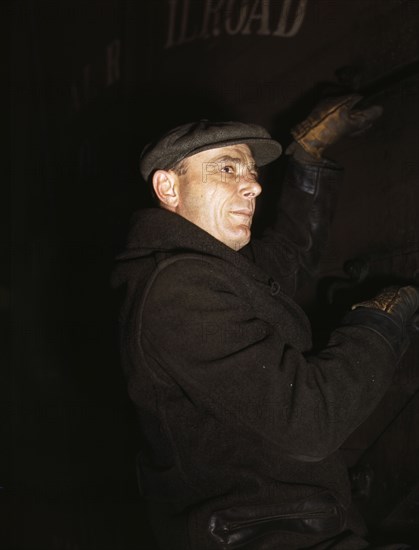 Frederick Batt, brakeman, on the C & NW RR, at Proviso yard, Chicago, Ill., 1942. Creator: Jack Delano.